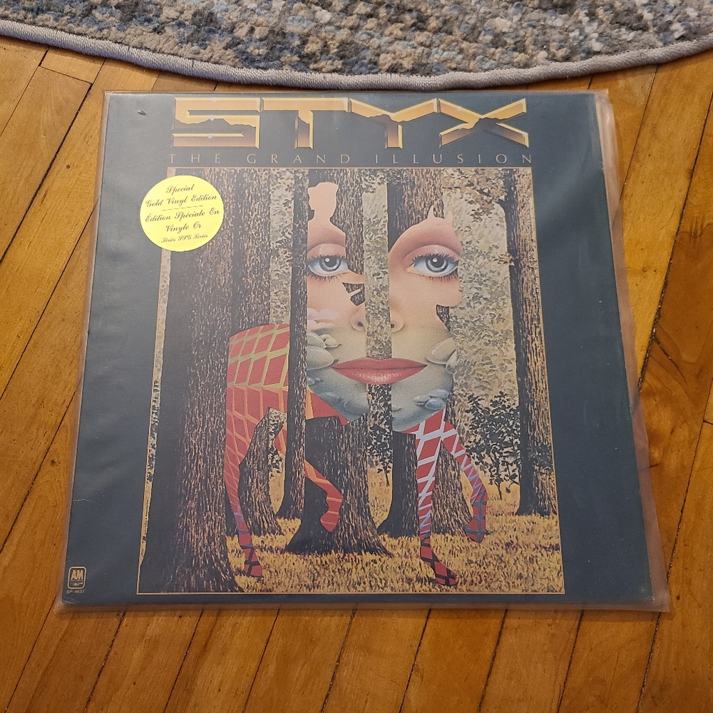 Styx The Grand Illusion vintage vinyl album.  LP is yellow  Pristine condition